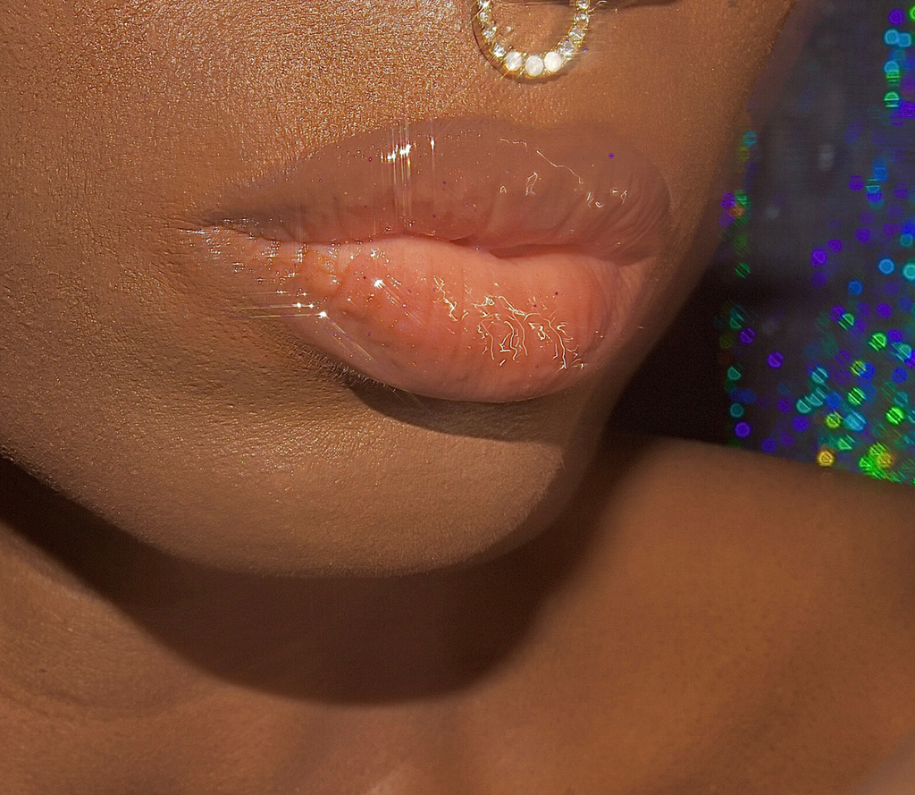 Coco Honey Dew sheer nude lipgloss with flecks of purple and gold glitter decadently juicy moisturizing non sticky universal sheer nude lipgloss nude lip gloss aesthetic nude lip gloss nude lip gloss for black women nude lipgloss swatches nude lipgloss names nude lipgloss for dark skin best lip gloss laesthetic clear lip gloss on lips clear lips clear lip gloss look pat McGrath lust gloss colourpop so glassy lip gloss anastasia beverly hills moon jelly