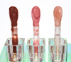Chocolate Veil is sheer dark chocolate lip gloss that leaves a slight veil of brown on the lip Coco Honey Dew is a sheer glittering tan lip gloss enriched with nourishing oils Pink me Nude is an glimmering opaque pinky nude gloss with a pinkish gold shimmer undertone