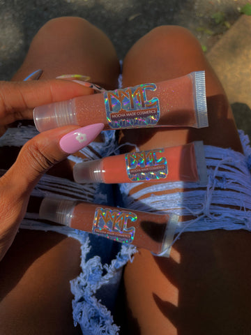 Chocolate Veil is sheer dark chocolate lip gloss that leaves a slight veil of brown Coco Honey Dew is a sheer glittering tan lip gloss enriched with nourishing oils Pink me Nude is an glimmering opaque pinky nude gloss with pinkish gold shimmer