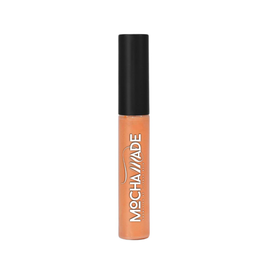  a high shine caramel nude lip gloss with warm beige undertone creamy slightly opaque finish with fine gold shimmer