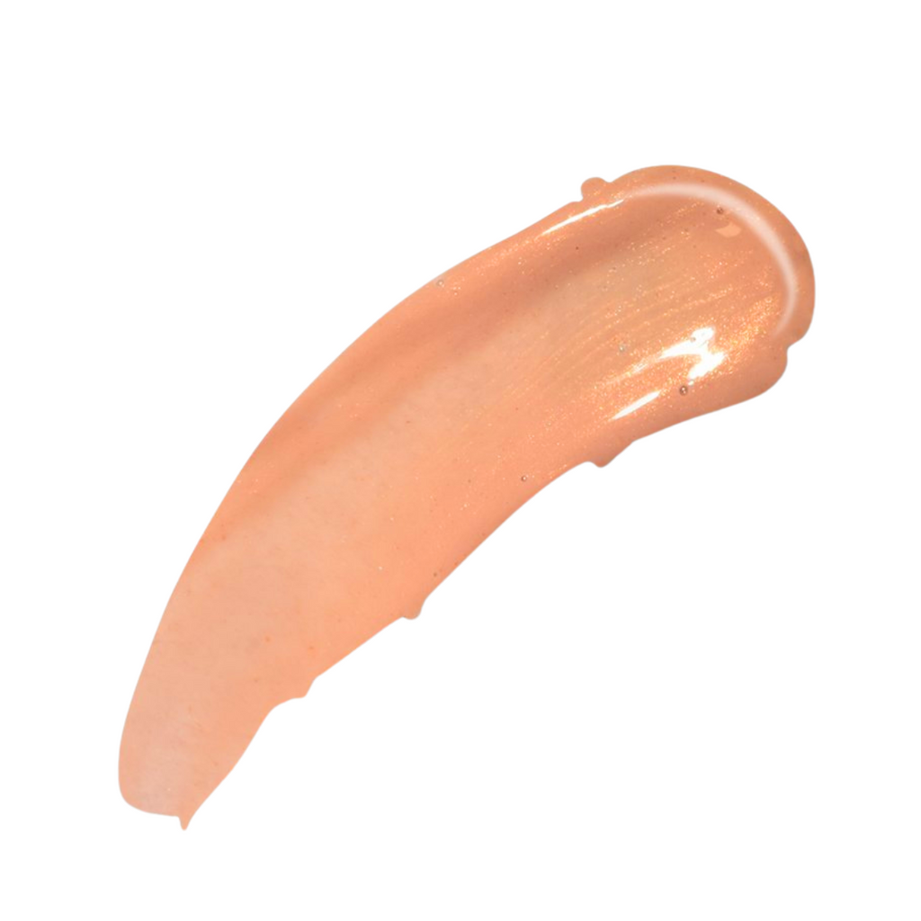  a high shine caramel nude lip gloss with warm beige undertone creamy slightly opaque finish with fine gold shimmer
