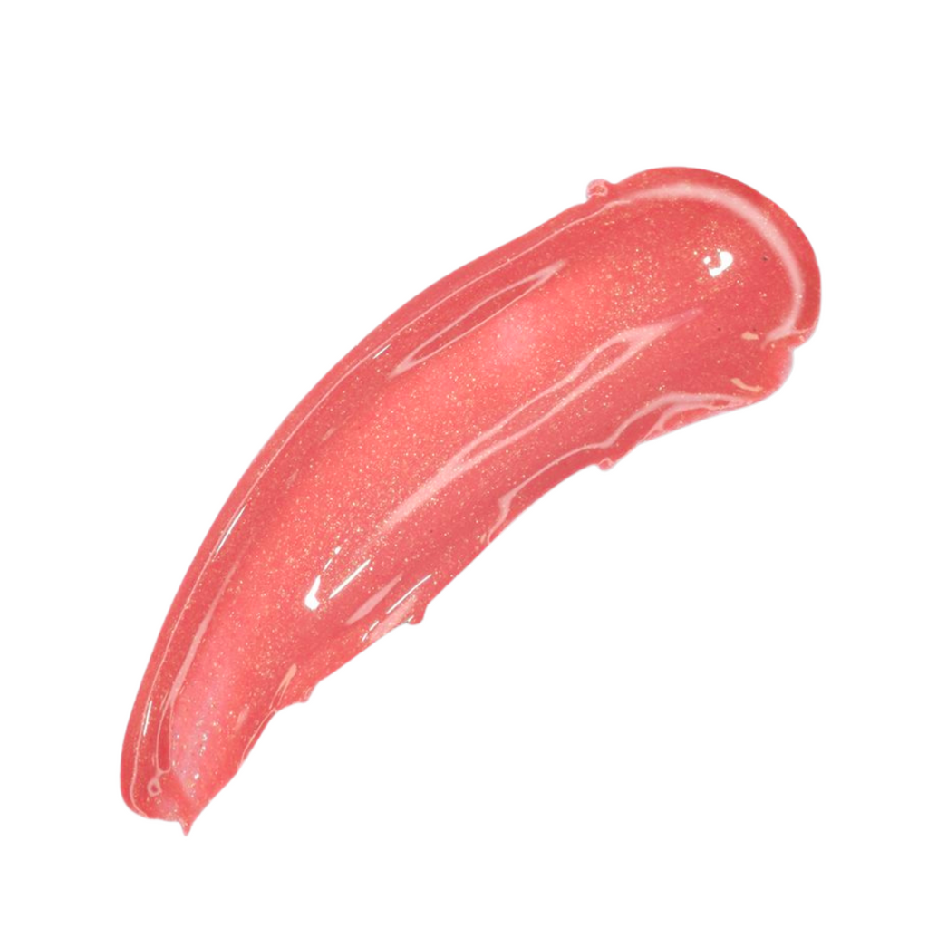 A glossy, textured swipe of coral pink glitter gel or lip color on a solid white background.