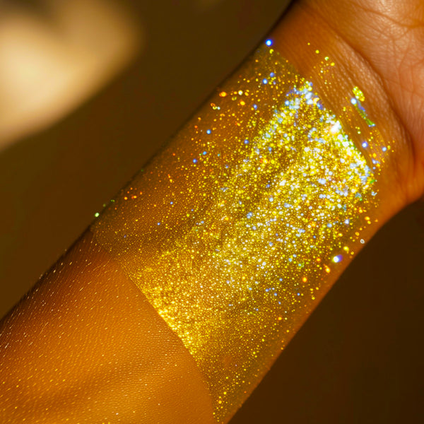 A bright gold with blue undertone  pearlescent duo chrome color shifting loose pigment multi chrome color shifting pigment
