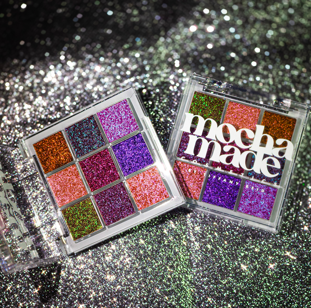 Multi chrome makeup eyeshadow palettes with glittery finish on a sparkling background