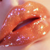 Leo AF is  a Golden bronze shimmering sheer lipgloss and Libra Vibes is a pinky orange sheer shimmering lipgloss