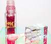 Ruby is a clear hydrating lip gloss with sparkling red and pink glitter