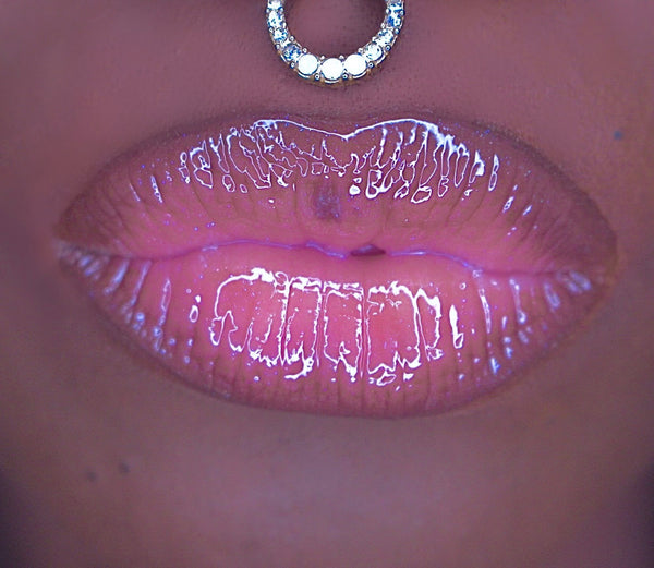 Luna is a sheer purple lip gloss with blue ethereal sparkles