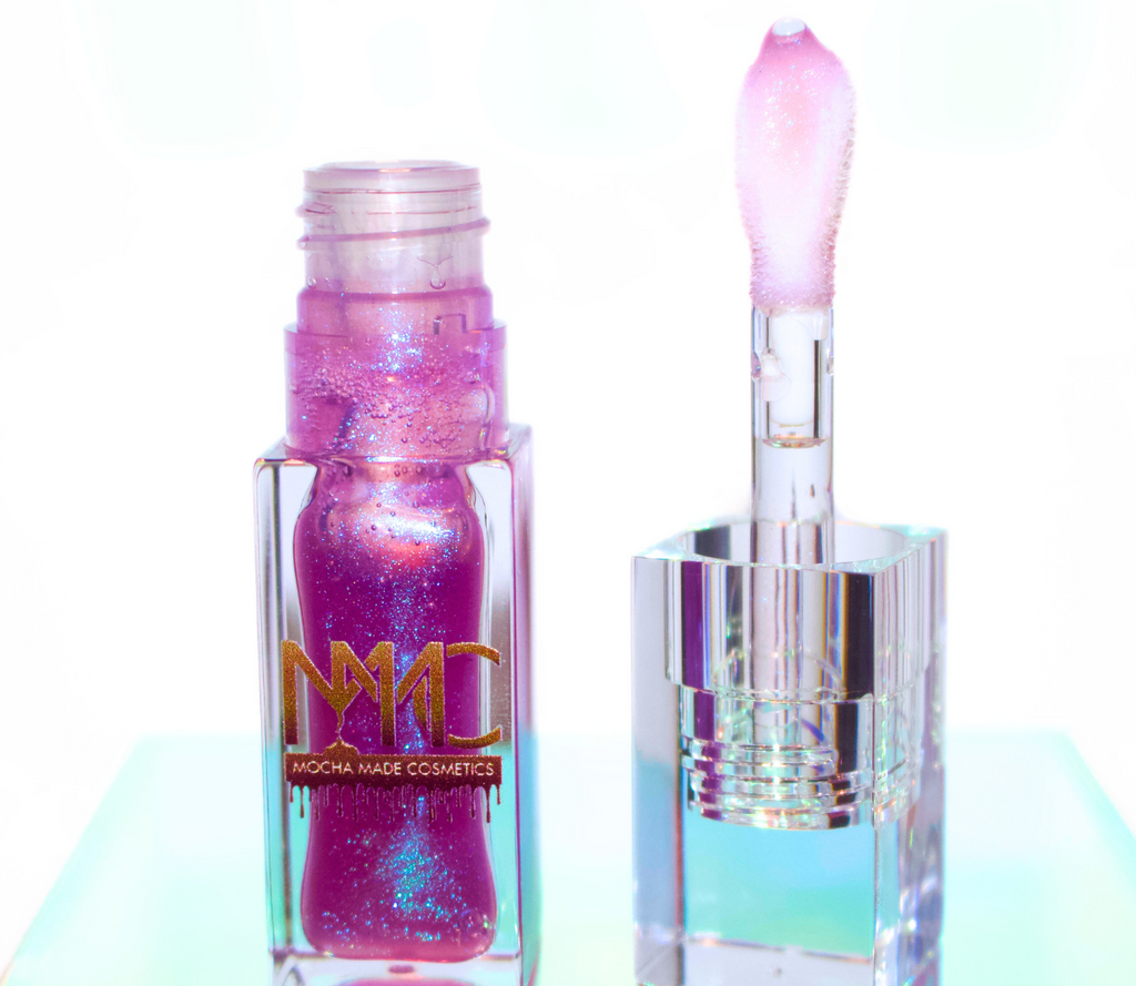 Luna is a sheer purple lip gloss with blue ethereal sparkles