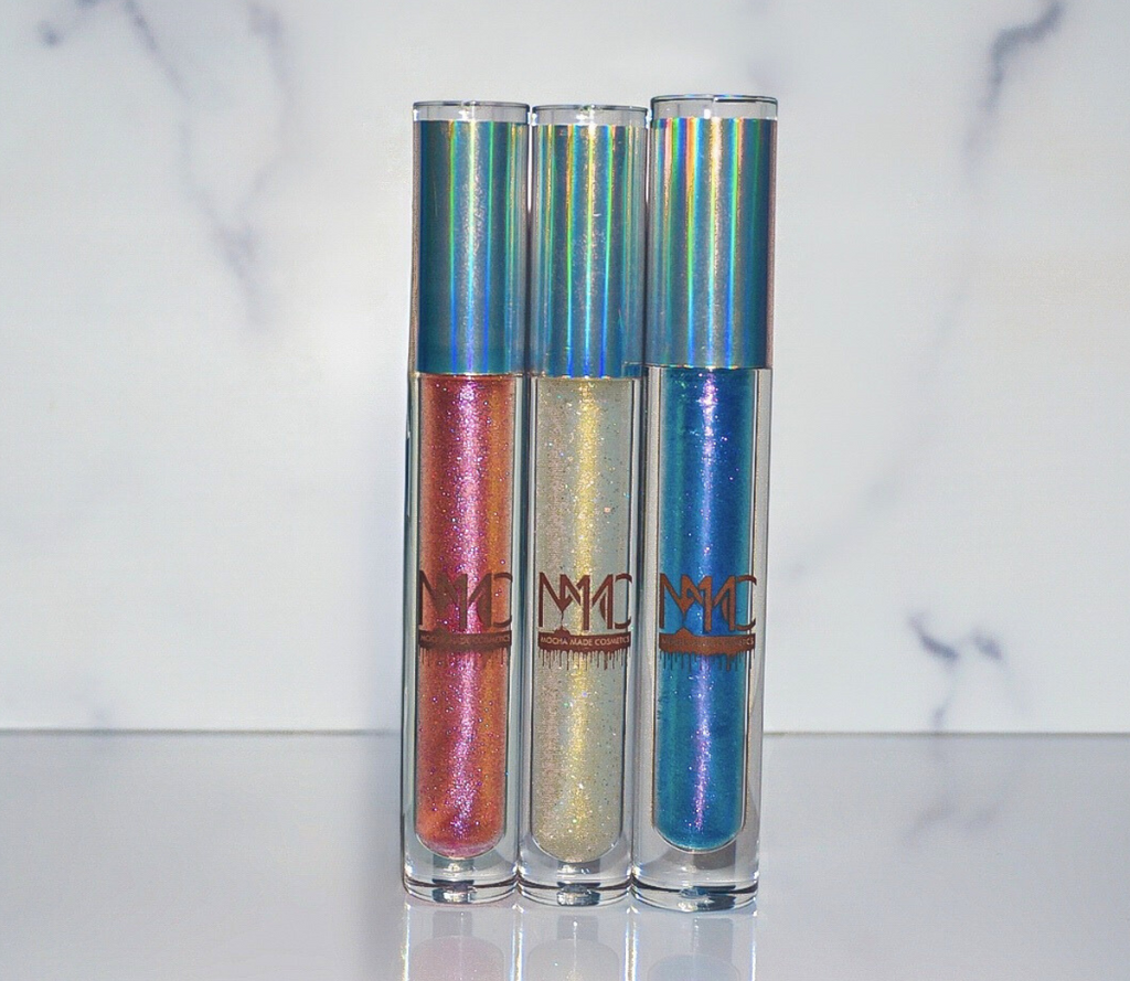 Andromeda Flex is sheer Blue Pink Purple Chameleon Color Shifting lipgloss That Gworl is a super sexy high shine gloss that's clear with a golden yellow sparkle with a yellow color shift undertone Libra Vibes is a sheer Pink / Golden / Orange Chameleon Color Shifting lipgloss