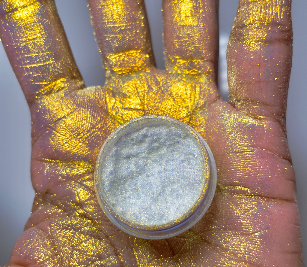 A bright gold pearlescent duo chrome color shifting loose pigment multi chrome color shifting pigment