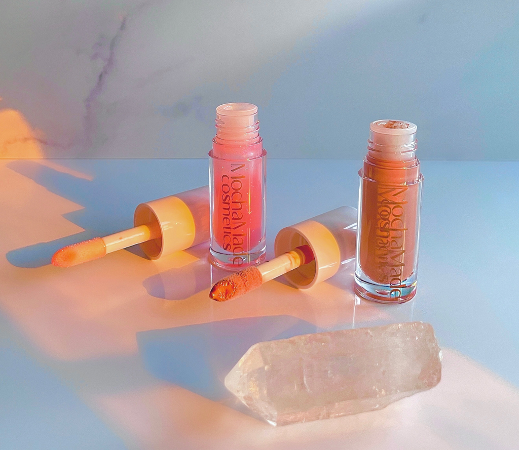  Pink me Nude is an opaque pinky nude gloss with a pinkish gold shimmer undertone Baby Girl  is a super high pink ethereal gloss with a pink purple holographic color shift that transfers as a gorgeous shimmery sheer light pink Part of our Fall Winter Color POPPIN Collection
